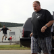 Illustration for article titled Hurry! Andy Reid Is Trying To Get Away!
